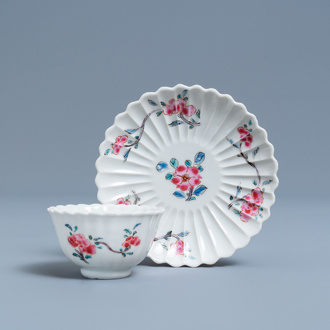 A lobed Chinese famille rose cup and saucer with floral design, Yongzheng